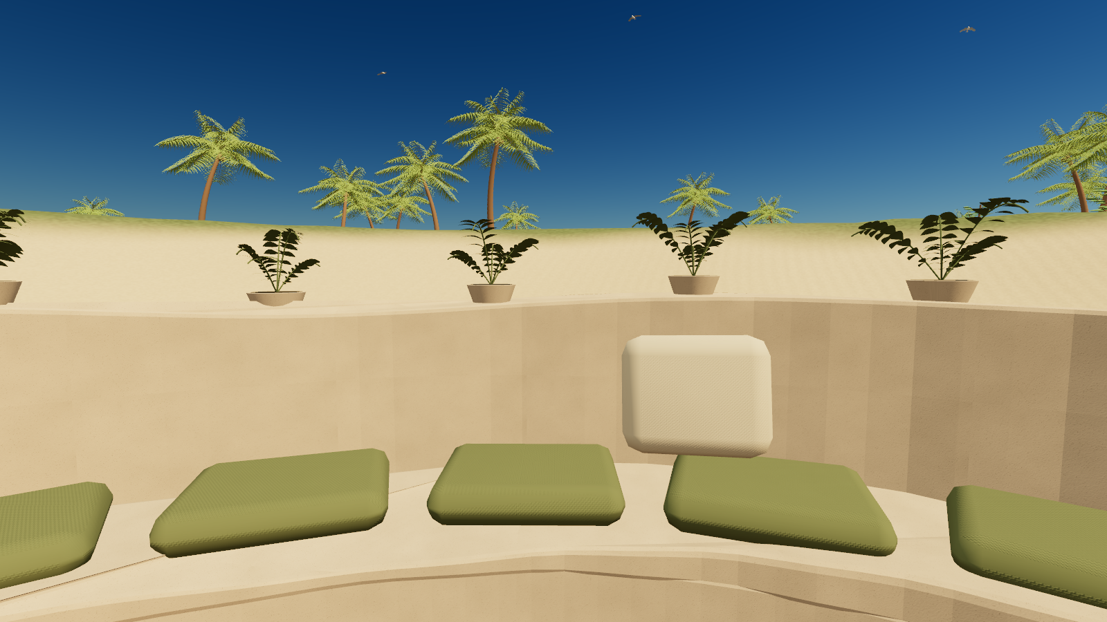A view from the cove seats, looking over the low wall toward the palms.